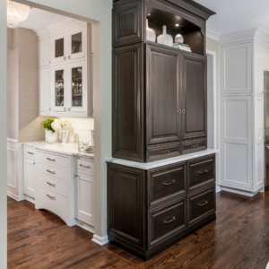 amberly-lane-china-cabinet A wooden china cabinet next to kitchen on a wood floor.