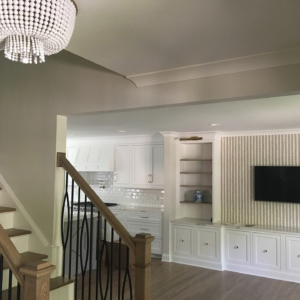 foyer A view of a foyer with a stairway on the left.